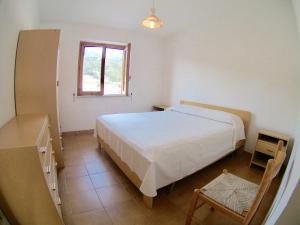 Giường trong phòng chung tại Residence Mareblu