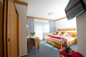 Voodi või voodid majutusasutuse Hotel Landhaus Neumayr toas
