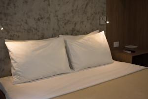 Postel nebo postele na pokoji v ubytování Anhembi Hostel