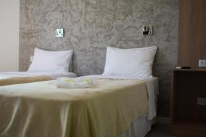 Postel nebo postele na pokoji v ubytování Anhembi Hostel