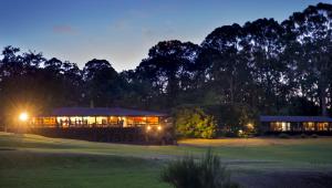 a building on a golf course at night at The Stirling Golf Club in Stirling