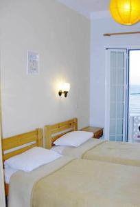 Кровать или кровати в номере Atlantis Hotel