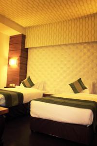 Postel nebo postele na pokoji v ubytování Hotel Ivory 32