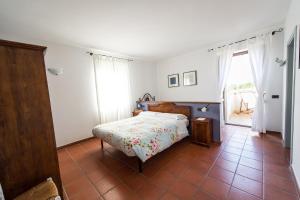 Postel nebo postele na pokoji v ubytování Agriturismo La Corte del Lupo