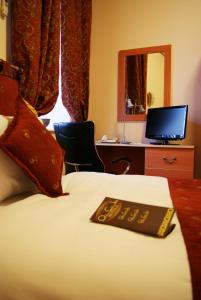 Μια τηλεόραση ή/και κέντρο ψυχαγωγίας στο Old City Inn Hotel