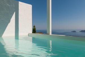 a swimming pool with a view of the ocean at Althea Traditional Hotel in Alonnisos
