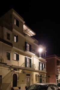 a building with a street light in front of it at Dimora Ciociola in Manfredonia