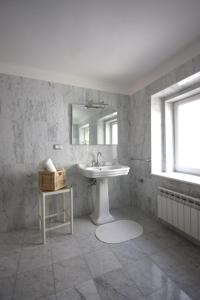 a bathroom with a sink and a mirror at Palazzo Brigido in Trieste