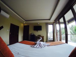 Postel nebo postele na pokoji v ubytování Cahyatika Bed & Breakfast