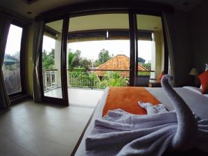 Postel nebo postele na pokoji v ubytování Cahyatika Bed & Breakfast