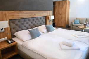 Postel nebo postele na pokoji v ubytování Hotel Diana