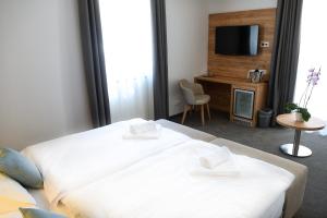 Postel nebo postele na pokoji v ubytování Hotel Diana