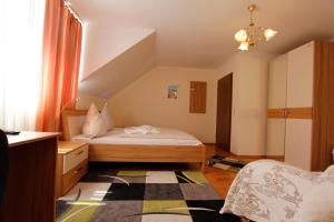 Postel nebo postele na pokoji v ubytování Hotel Adria Stuben