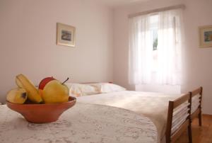 Postel nebo postele na pokoji v ubytování Apartments & Rooms Nada