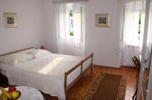 Postel nebo postele na pokoji v ubytování Apartments & Rooms Nada