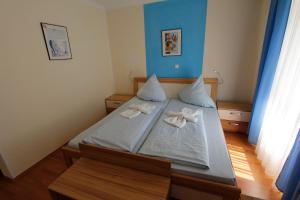Postel nebo postele na pokoji v ubytování Hotel Adria Stuben