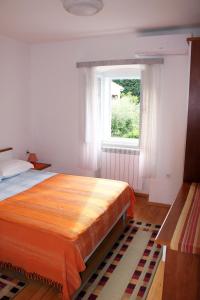 Postel nebo postele na pokoji v ubytování Apartments & Rooms Nada