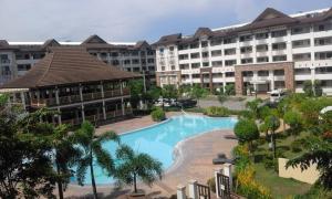 an aerial view of a resort with a swimming pool at Bords Sweet Home in Davao City