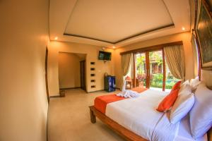 Postel nebo postele na pokoji v ubytování Cahyatika Bed & Breakfast