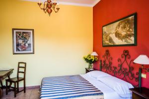 Postel nebo postele na pokoji v ubytování Hotel Il Bargellino