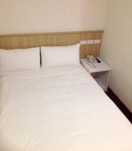 Postel nebo postele na pokoji v ubytování Long Cherng Hotel