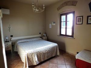 Posteľ alebo postele v izbe v ubytovaní Agriturismo San Martino