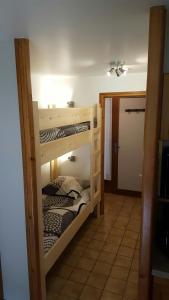 two sets of bunk beds in a room at Le Marquis in Morzine