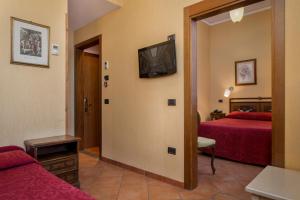 Postel nebo postele na pokoji v ubytování Hotel Kursaal & Ausonia