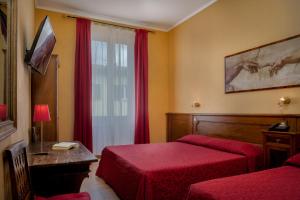 Postel nebo postele na pokoji v ubytování Hotel Kursaal & Ausonia