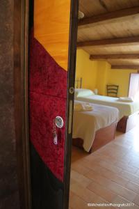 Cama ou camas em um quarto em La Casa di Ivana
