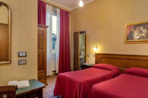 Postel nebo postele na pokoji v ubytování Hotel Kursaal & Ausonia