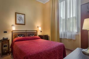 Postel nebo postele na pokoji v ubytování Hotel Kursaal & Ausonia