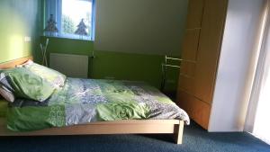 Łóżko lub łóżka w pokoju w obiekcie B&B de Kornelishoeve