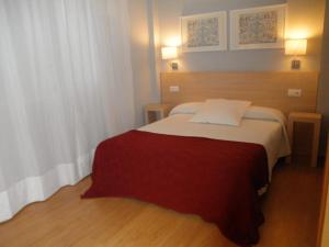 Postel nebo postele na pokoji v ubytování Dormavalencia Hostel