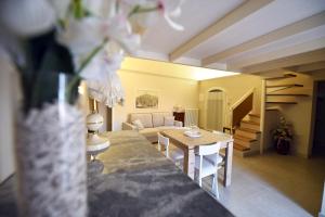 a living room with a couch and a table at Antica Dimora storica La finestra sul campanile in Matera