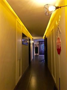 an empty hallway with a stop sign in a room at The Museum Hotel in Nakhon Pathom