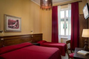 Postel nebo postele na pokoji v ubytování Hotel Kursaal & Ausonia