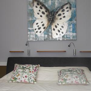 Кровать или кровати в номере Het Harlekijntje