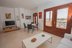 A television and/or entertainment centre at Apartment Overlooking Pool & Lagoon for Rent in Sabina El Gouna Egypt