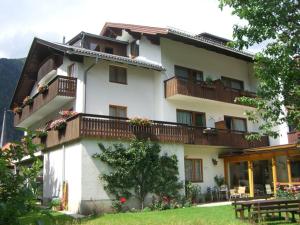 a large white building with balconies on it at Gästehaus Truskaller in Mallnitz