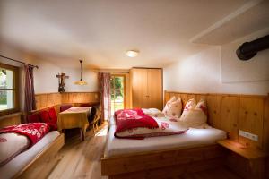 Posteľ alebo postele v izbe v ubytovaní Birnbaum Chalets Grossarl