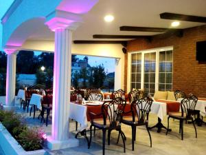 a restaurant with a table and chairs at Sarban Hotel in Fethiye
