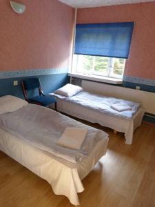 Postel nebo postele na pokoji v ubytování Viva Pirita Hostel