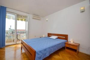 Postel nebo postele na pokoji v ubytování Apartmani Meri