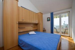 Postel nebo postele na pokoji v ubytování Apartmani Meri