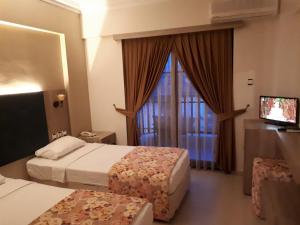 Postel nebo postele na pokoji v ubytování Hamle Hotel