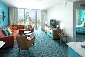 a living room with a couch and a bed at Universal's Cabana Bay Beach Resort in Orlando