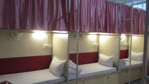 Una cama o camas en una habitación de Vinayak Guest House