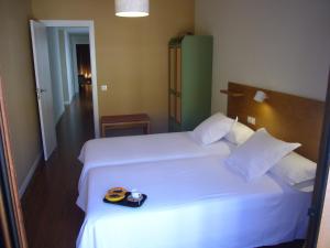 A bed or beds in a room at Littore TORMES con Parking, AA y Piscina
