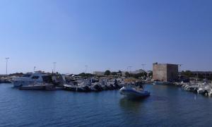 a bunch of boats are docked in a harbor at Il Pergolato in Torre Pali